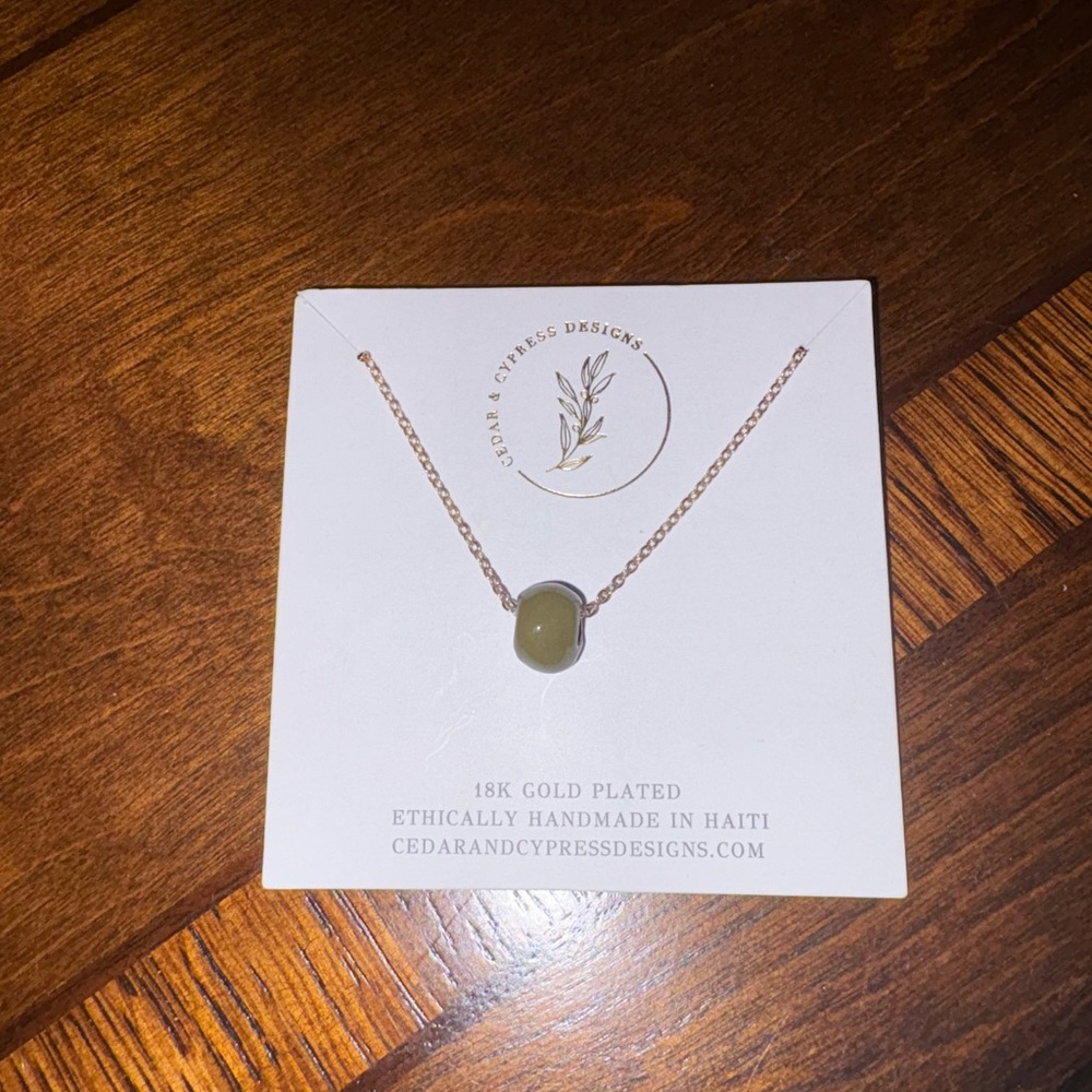 Elegant Gold and Green Necklace with Minimalist Design